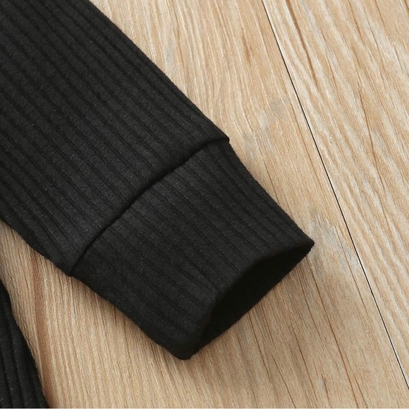 Baby Romper in Black with Henley Button Detail - Picture 5 of 5